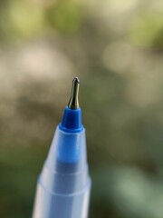 close up of a blue pen