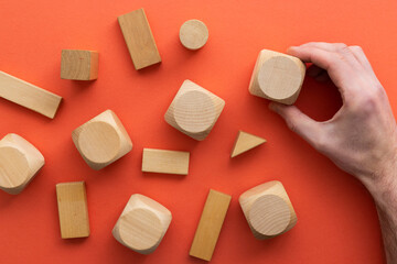 Hand choosing a wooden block from a set. Business choice concept