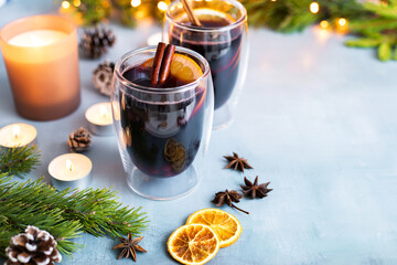 Hot freshly brewed homemade mulled wine with orange slices, cinnamon stick and anise. Traditional...