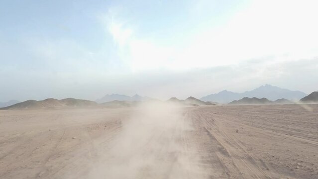 Desert safari with jeep sand and dust smoke