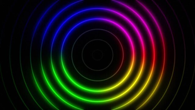 Abstract seamless loop neon four colours gradient concentric circle on a black background. Bright neon lights motion for glamour concept. For compositing, and stylizing your video.