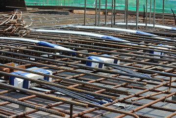 
MALACCA, MALAYSIA -APRIL 14, 2016: Pre-stress cable tendons for prestressed concrete at the construction site. It is a technology to get better concrete slab quality with larger span. 