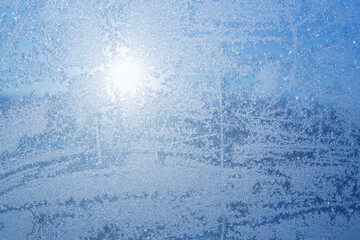 Fototapeta premium blue frost pattern on window at winter