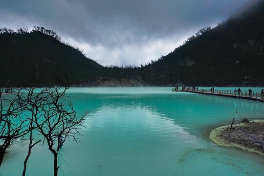 Scenic view over the white crater lake of kawah putih in West Java, Indonesia on a cloudy day