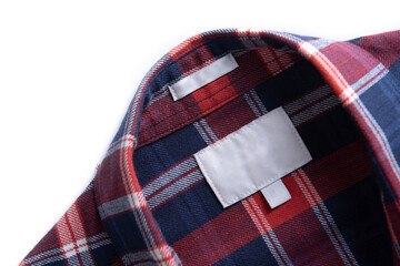 White blank clothing tag label on new shirt fabric texture background
