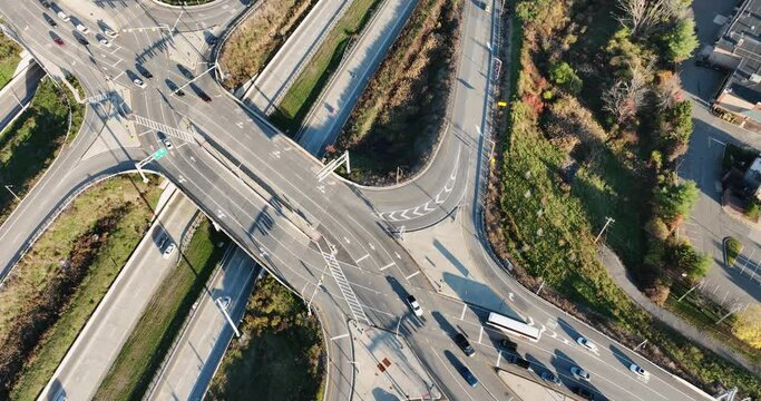 Aerial, drone, afternoon video of a diverging diamond interchange (DDI), located in Woodbury, NY.