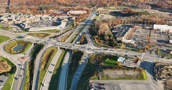 Aerial, drone, afternoon video of a diverging diamond interchange (DDI), located in Woodbury, NY, orbiting subject location.