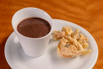 Bean broth with crackling. Traditional Brazilian appetizer.