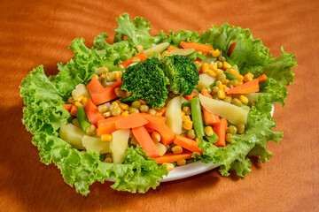 Vegetable salad, with broccoli, carrots, potatoes, chayote, corn, lettuce, green beans and peas. Brazilian cuisine.