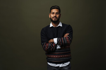Portrait of adult indian man in pullover over shirt isolated
