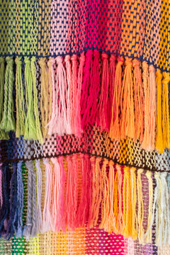 Colorful weaved carpet with threads