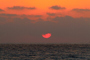 The sun sets below the horizon on the Mediterranean Sea in northern Israel.