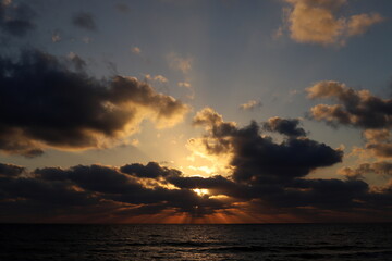 The sun sets below the horizon on the Mediterranean Sea in northern Israel.
