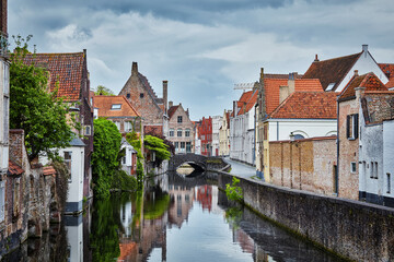Fototapeta na wymiar Canal, bridge and medieval houses in Bruges (Brugge), Belgium