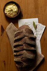 Brown bread on wooden table. Flat lay, top view. Bakery concept.