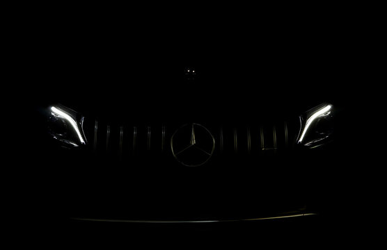 headlight led ray of the sports luxury Mercedes Benz c-class c200 coupe AMG dynamic model park in dark garage for checking maintance before delivered to customer