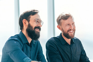 employer shaking hands with a new employee of the company.