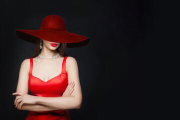 Young brunette woman with red lips makeup and diamond necklace and earrings and in burgundy wide...