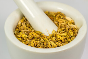 Fennel seeds, medicinal drug and spice in a mortar