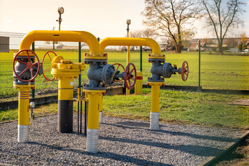 Gas pipes, natural gas transport system. Transmission infrastructure coming from the ground, yellow...