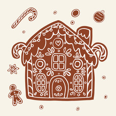 Gingerbread house for Christmas. Cute handmade honey gingerbread with patterns and sweets.