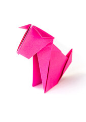 Pink paper dog origami isolated on a white background