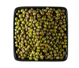 Organic raw green beans mungo in ceramic bowl isolated on white, top view