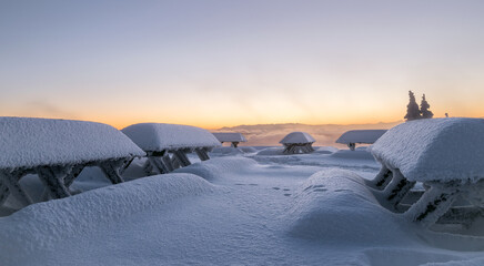 Winter landscape in Czech mountains. Snowy nature during sunrise. Frozen mountains and trees. Lysa...