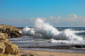 waves breaking on the rocks