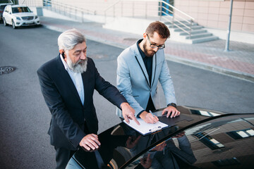 business people working outside office building