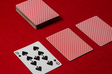 Game cards on a red background. Gambling concept