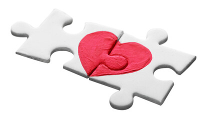 Puzzle pieces with painted red heart on it, white background