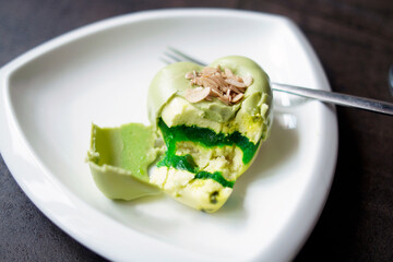 Green cake in the shape of a heart