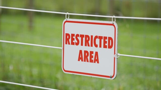 restricted area at public park zoo in red text white sign