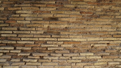 Detail of a wall in Roman structure made of bricks and with the opus reticulatum technique in...