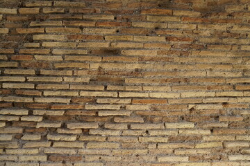 Detail of a wall in Roman structure made of bricks and with the opus reticulatum technique in...
