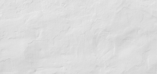 Fototapeta na wymiar Painted white concrete wall background. Panoramic texture of a beautiful mediterranean white wall in a village