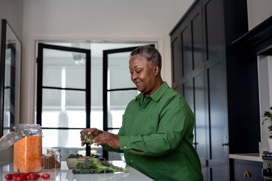 Senior african american female cooking a healthy meal