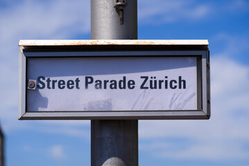 Sign at Quay Bridge at City of Zürich with text Street Parade Zürich on a sunny summer day. Photo taken August 13th, 2022, Zurich, Switzerland.