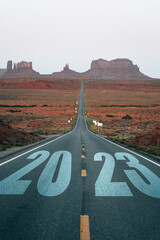 road to 2023. the road leads to the monument valley at sunrise in the desert of USA