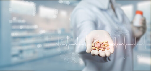 Pharmacist showing pills .