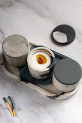 soy wax candles on a marble stand, top view