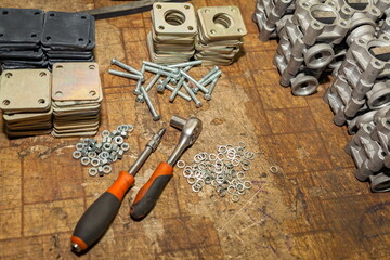 Key, screwdriver, fasteners and parts for assembling the oil indicator on the mounting table