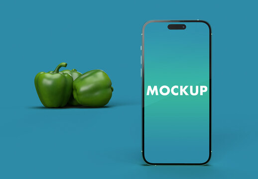 iphone 14 Pro Max and the Green Peppers on a Turquoise Background