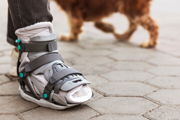 Ankle Splint Boots or Leg Orthosis Bandage Shoes allows to walk the Dog Outdoor. 