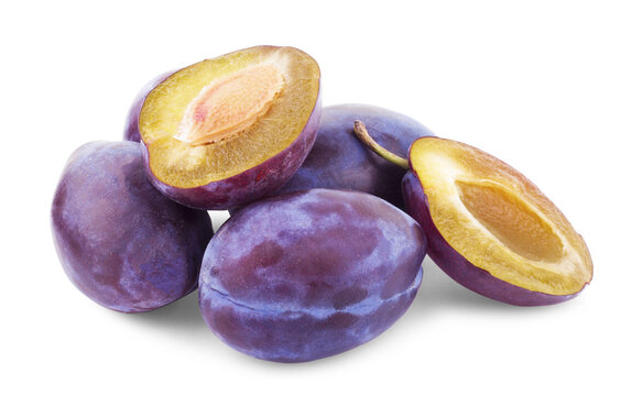 Three plums with leaves on white background.
