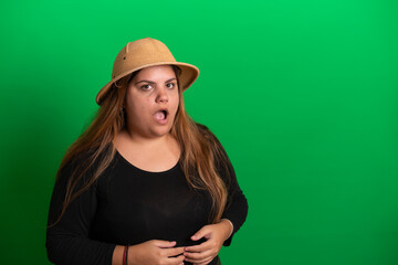 Young woman wearing a hat,  Green Background