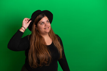 Young woman wearing a hat,  Green Background