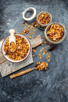 Bowl with granola on a blue background. superfood concept. Healthy, clean eating. Vegan or gluten free diet. vertical image. top view. place for text
