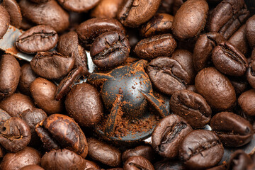 Close-up of coffee beans in an electric coffee grinder.